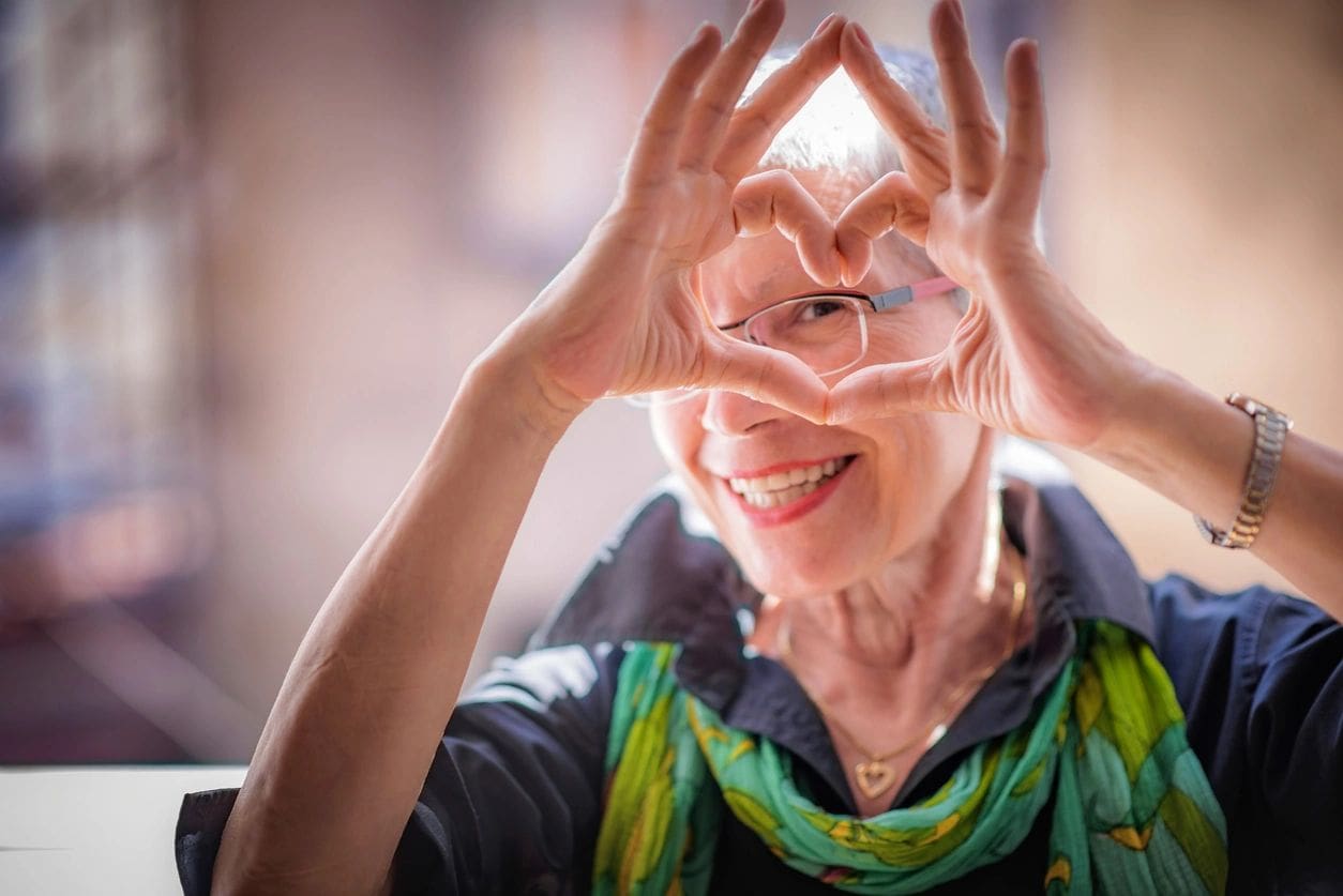 qtq80-dczGea A woman making a heart with her hands.